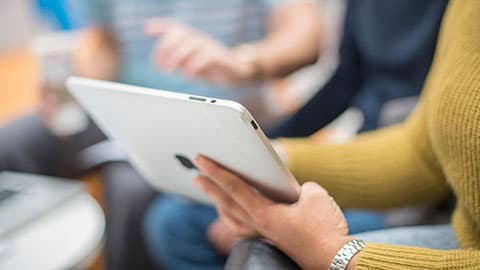 A tablet being held by someone