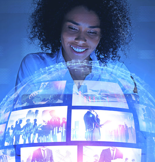 Woman watching streamed videos arranged in a globe shape