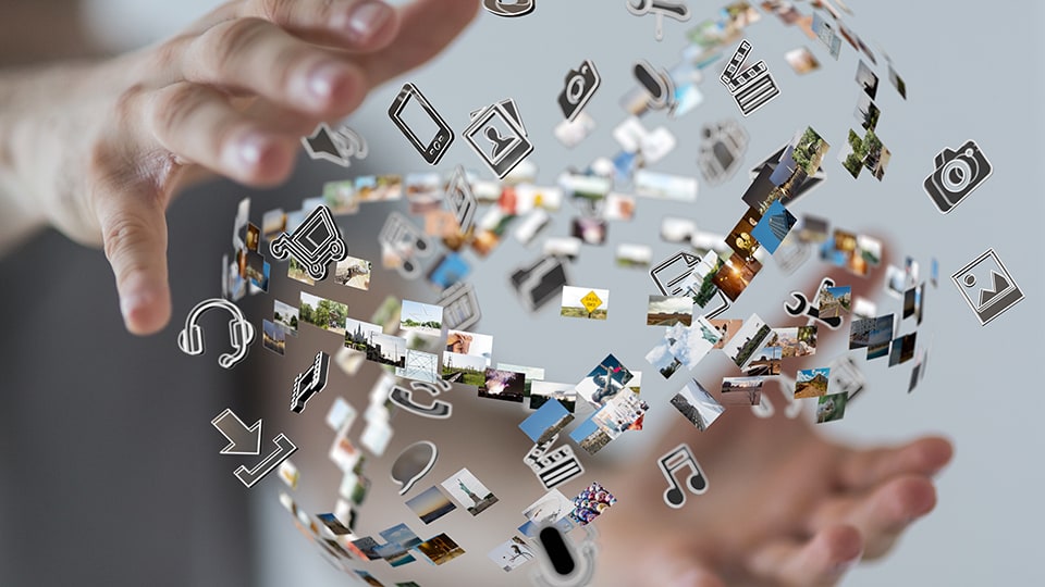 Hands with images and icons related to communication and culture