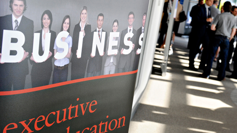 Delegates at a training event, networking during a break