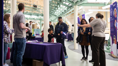 One of the stands at the exhibition - visitors talking to the Team