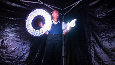 A visitor to the exhibition, exploring one of the activities