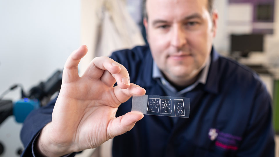 Researcher examining a slide