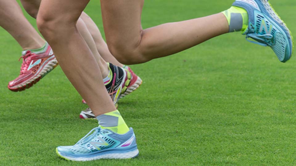 A cropped image of runners' legs