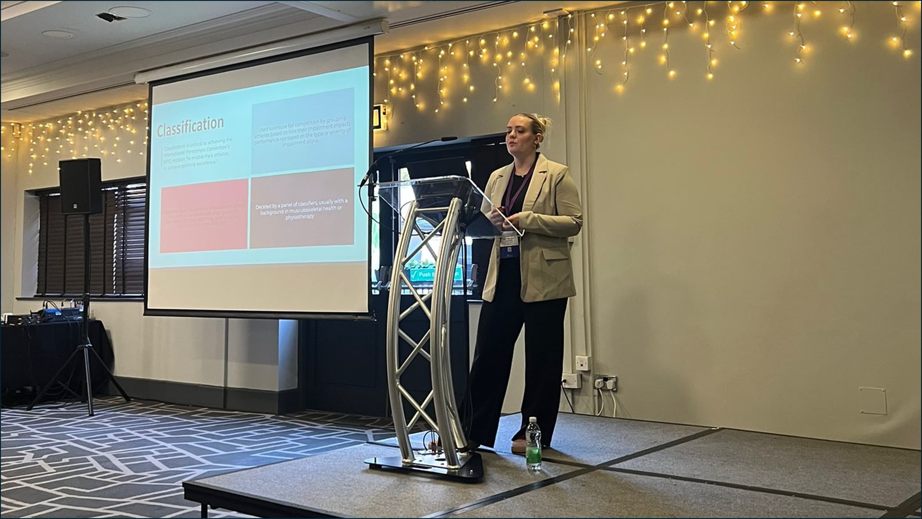 Doctoral researcher Ellie-May Storr presenting at a conference