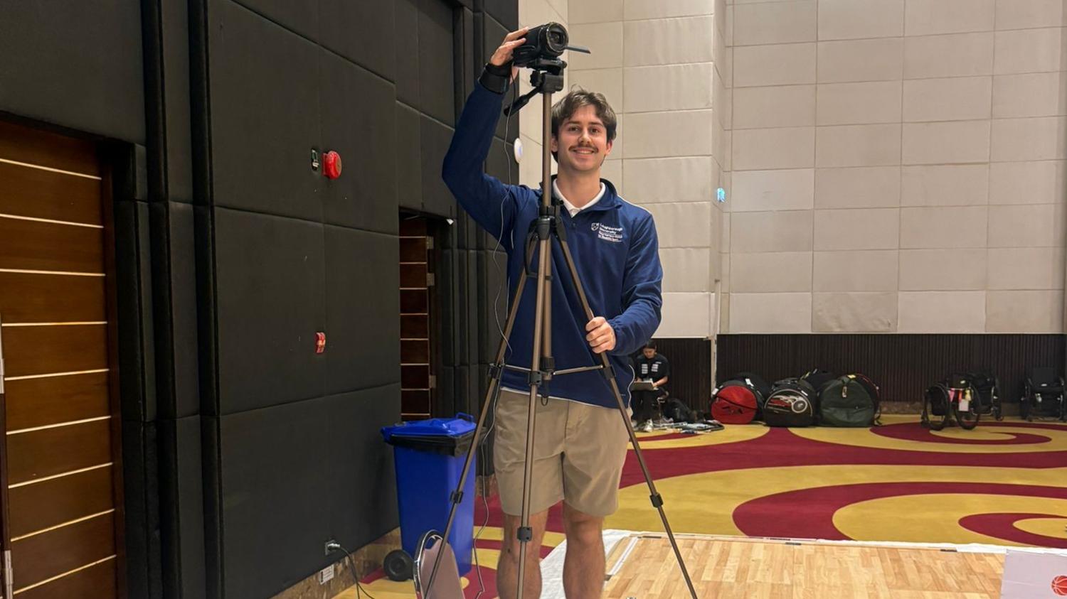 A photo of Owen Tolfrey setting up the cameras to collect data at the wheelchair rugby championships
