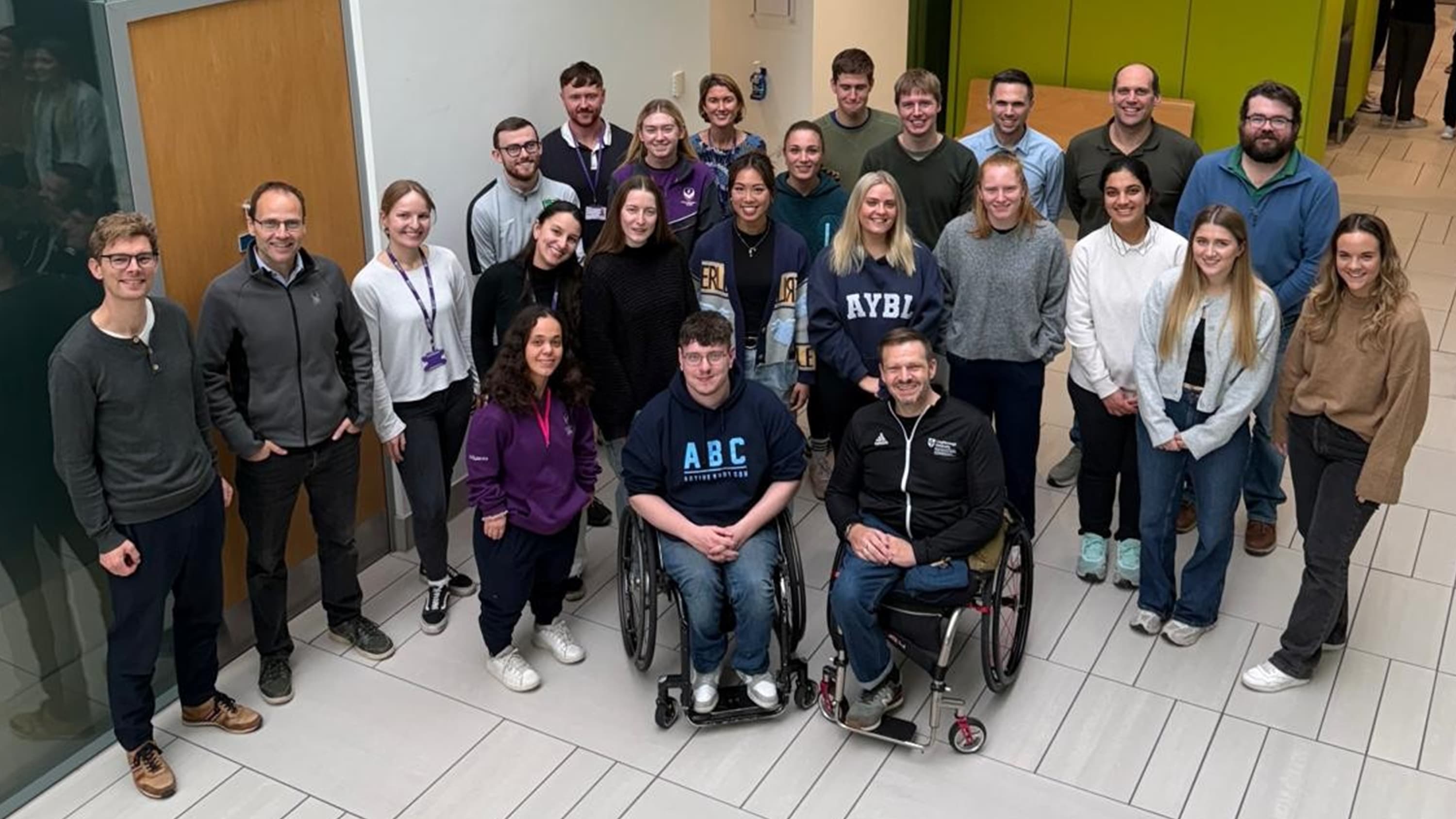 A picture showing the new ParaFit research cluster students along with their colleagues from the Peter Harrison Centre for Disability Sport
