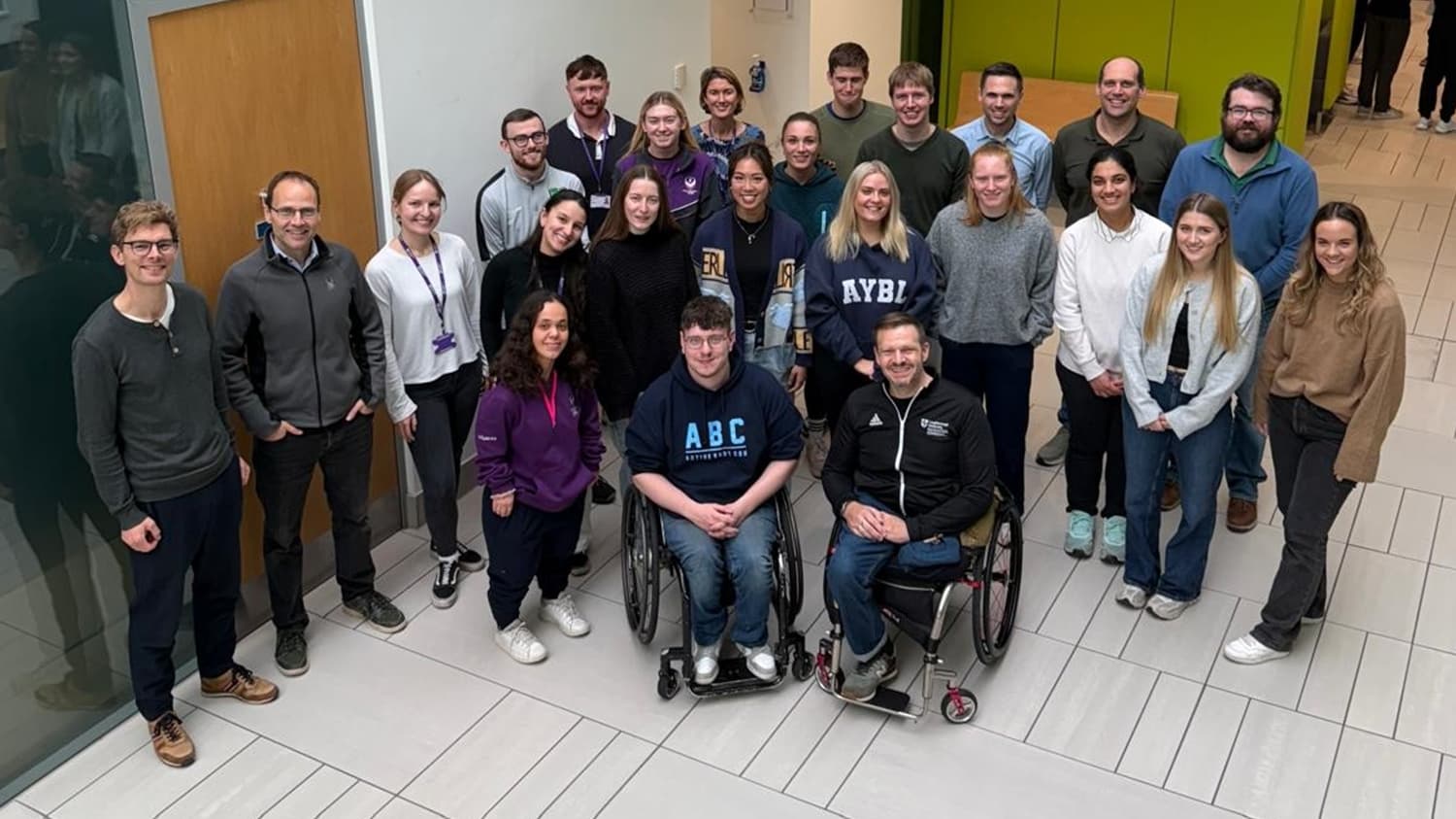 A picture showing the new ParaFit research cluster students along with their colleagues from the Peter Harrison Centre for Disability Sport