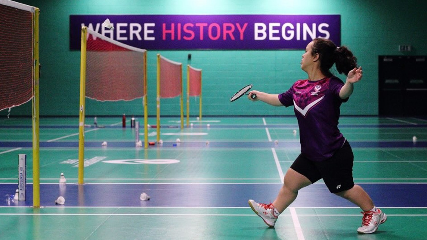 Doctoral researcher Yasmina Eissa playing badminton