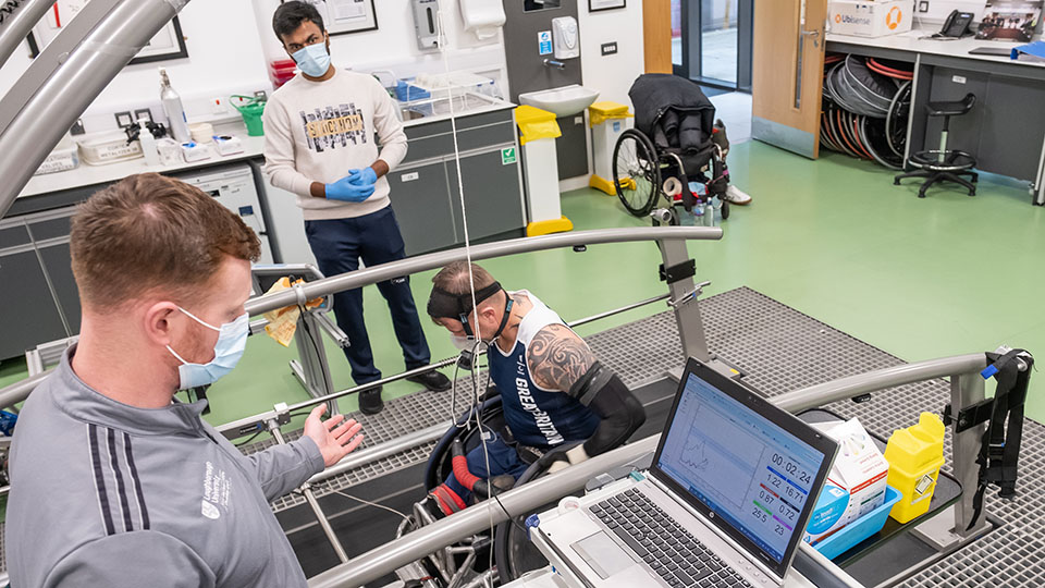 A Doctoral Researcher monitor performance of an elite para-athlete