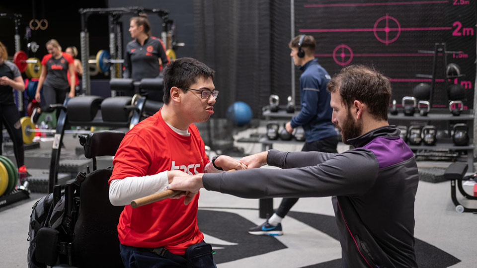 A coach and athlete training in Powerbase