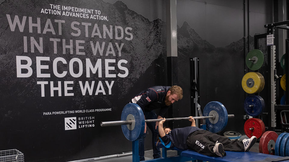 Coach and weightlifter training in Powerbase