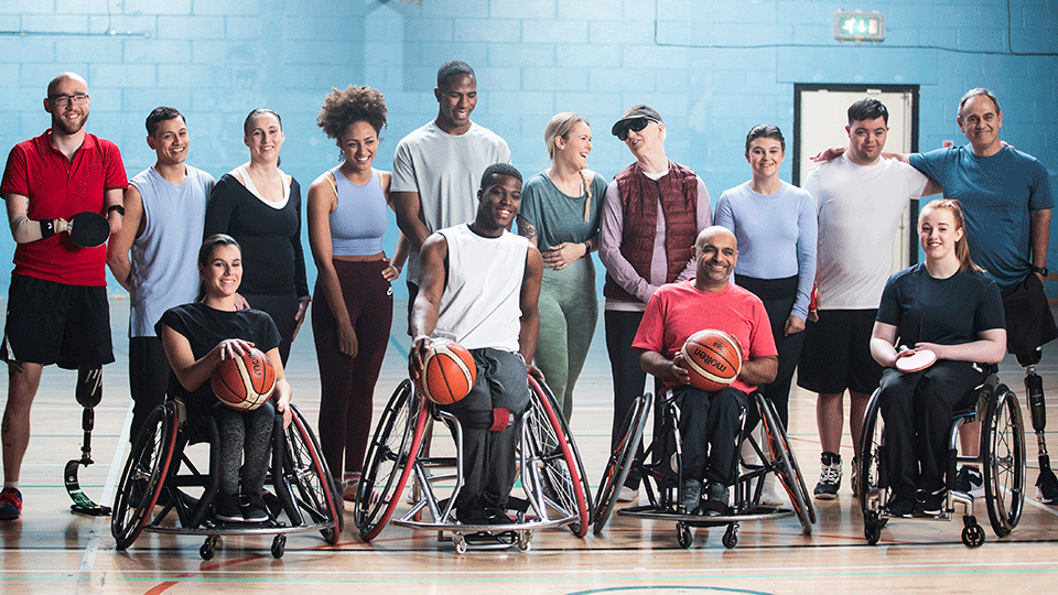 Group of impaired individuals in community shoot for para sport.