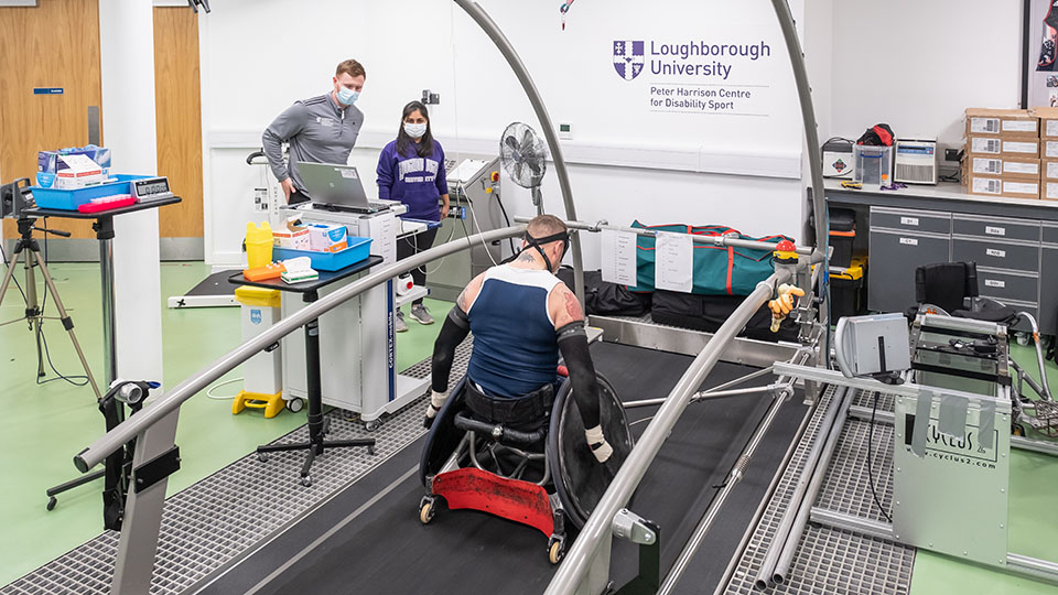 Stuart Robinson, Tokyo Paralympic Gold GB Wheelchair Rugby medallist, in the PHC lab with PHC PhD and master’s students.
