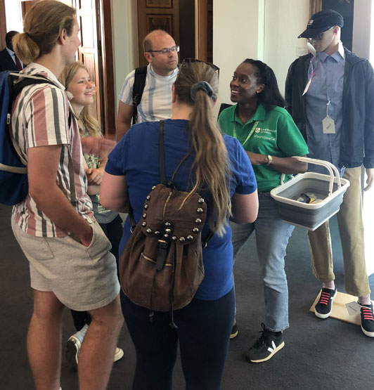 Visitors to the Exhibition chatting to one of the scientists