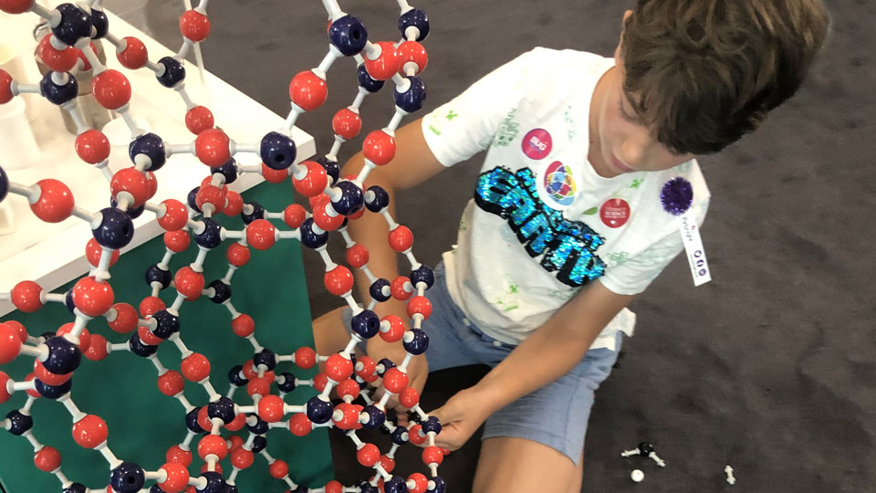 A young visitor to the Exhibition explores one of the activities