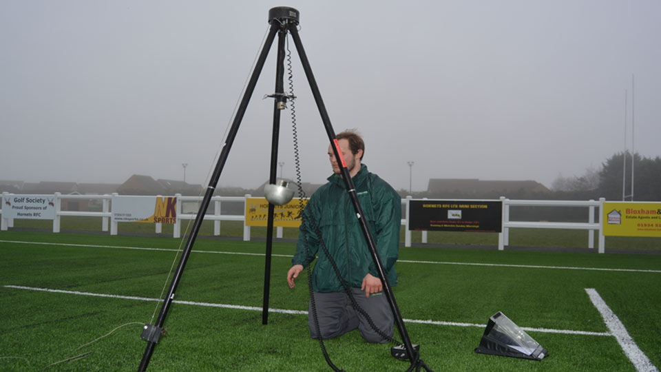 A technician running a pitch surface test