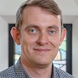 A headshot of Stuart King