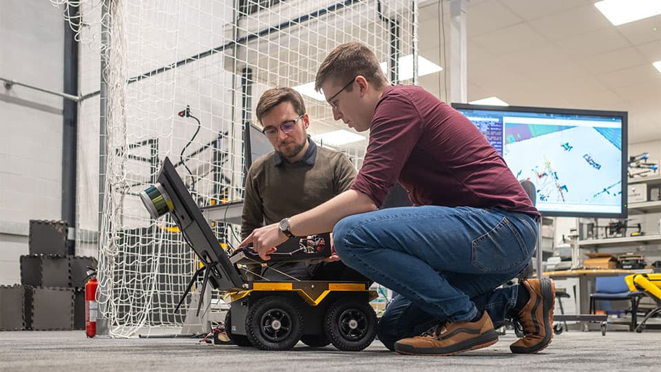 2 research students working in autonomous lab