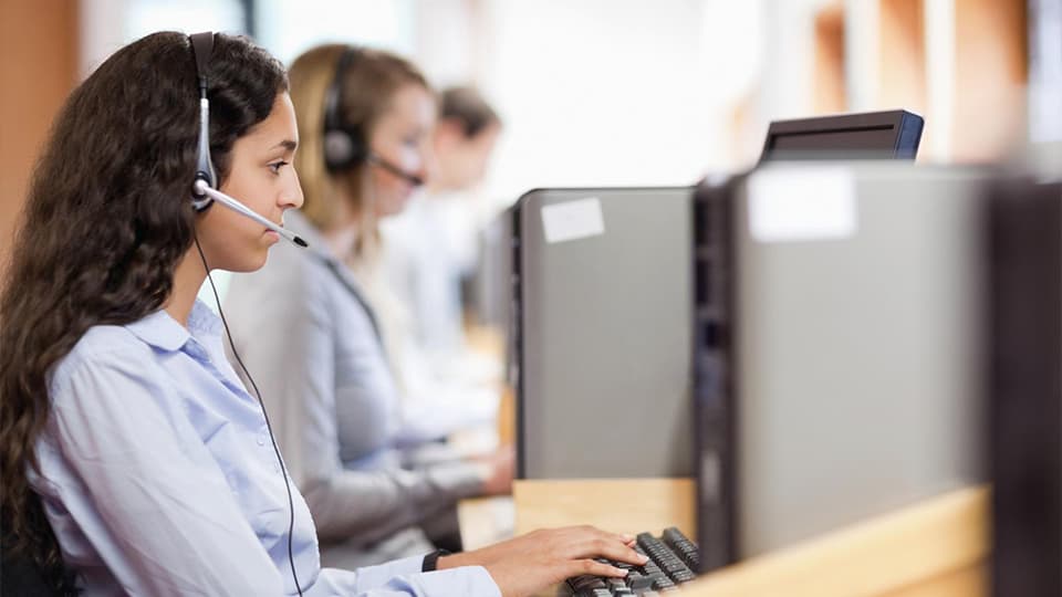 woman in call centre with headset