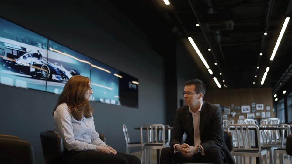 student at her placement in Rolls-Royce with her supervisor
