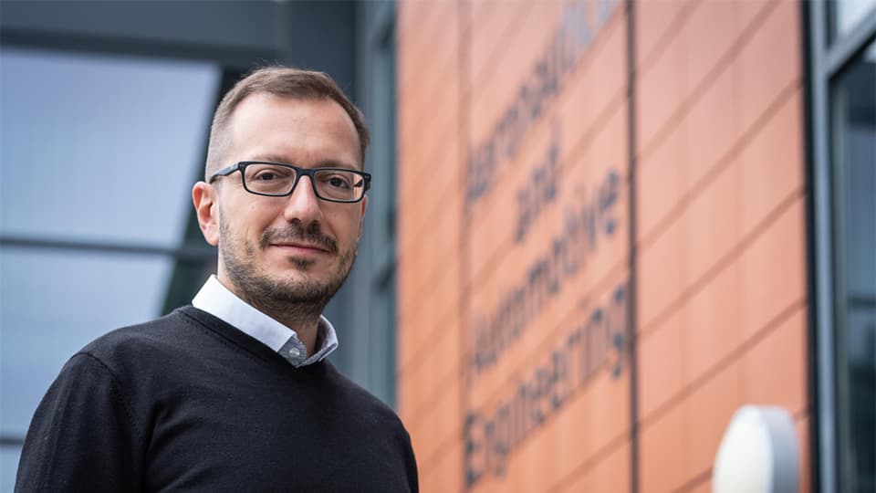 Georgios (head of AAE) standing outside the Penrose Atrium