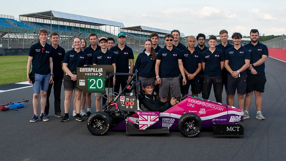Formula Student team with car at Silverstone.