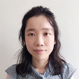 Headshot of Jingjing with plain background