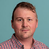 Headshot of Matt Coombes with teal background