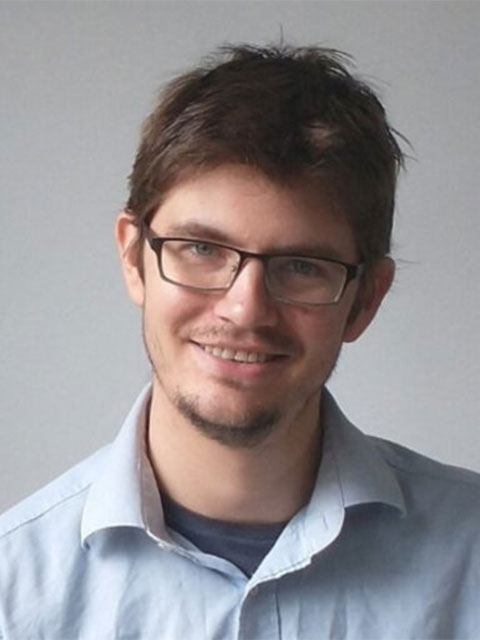 Headshot of Rob smiling.