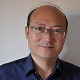 Headshot of Wen-Hua with plain background