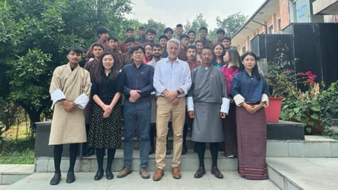 a group of people stand for a photo