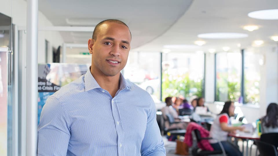 A student standing facing the camera