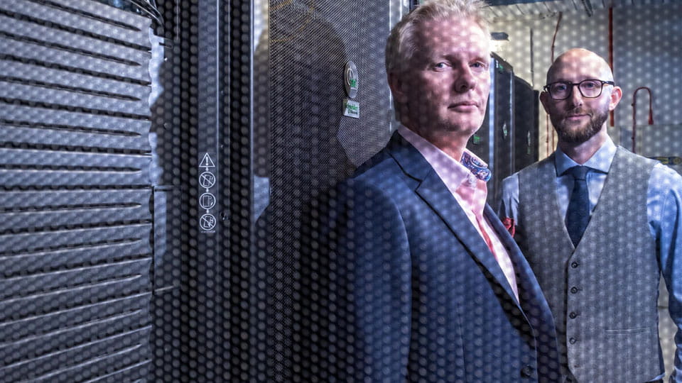 Two men in a data centre