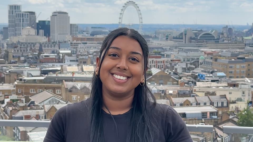 Nivetha with the London skyline in the background.