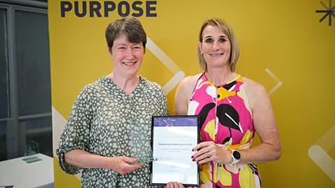 Amanda Berry receiving an award from the Dean.