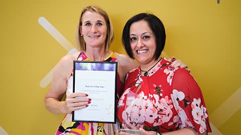 Kavita Sirichand receiving an award from the Dean.