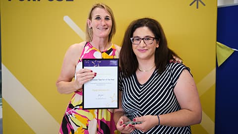 Peggy Alexopoulo receiving an award from the Dean.