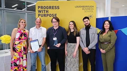 Loughborough Business School Placements Team receiving an award from the Dean.