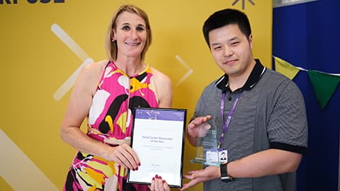 Qilin Hiu receiving an award from the Dean.