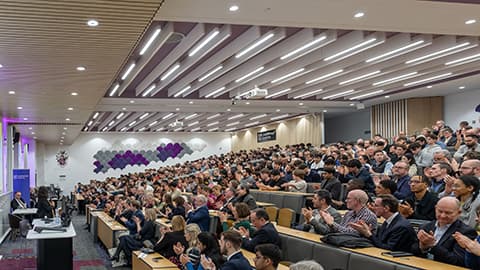 Audience members of Andrew Bailey's speech applauding