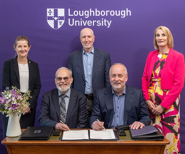Representatives from Loughborough University and MIT signing an official partnership agreement.