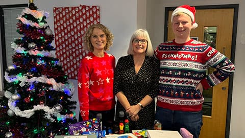 Kate Broadhurst, Vicki Unwin and Tomasz Cendrowski with items collected for the Christmas appeal.