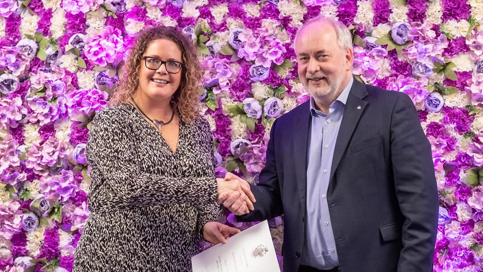 Aly Howells-Chivers shaking hands with Nick Jennings.