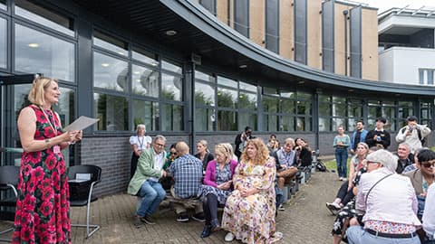 Jan Godsell delivering a speech to colleagues outside.