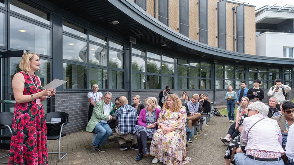 Jan Godsell delivering a speech to colleagues outside.
