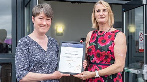Amanda Berry receiving an award from Jan Godsell.