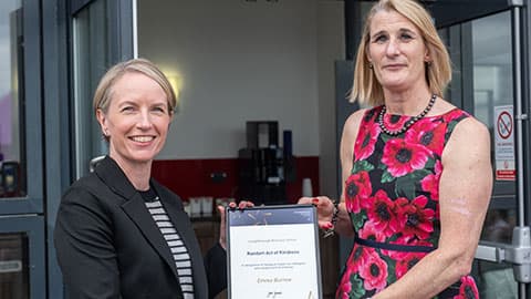 Emma Burrow receiving an award from Jan Godsell.
