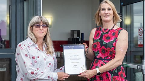 Elaine Conway receiving an award from Jan Godsell.