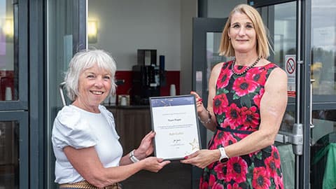 Ruth Cufflin receiving an award from Jan Godsell.